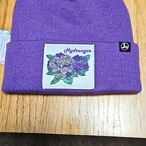 Cute lilac colored beanie with floral patch.